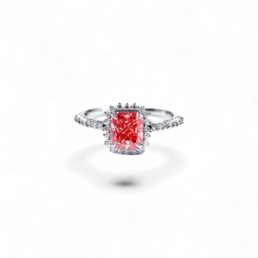 Anillo AVA & SSILAQUÉ de oro blanco de 14 quilates con un diamante rosa radiante central y diamantes blancos laterales.