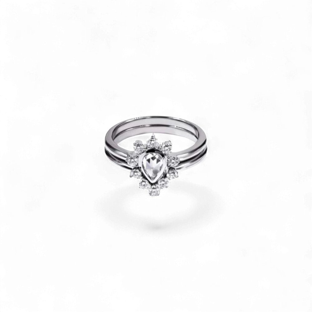 AVA & SSILAQUÉ Anillo de oro blanco de 14K con diamante de pera central y diamantes redondos acentuados.