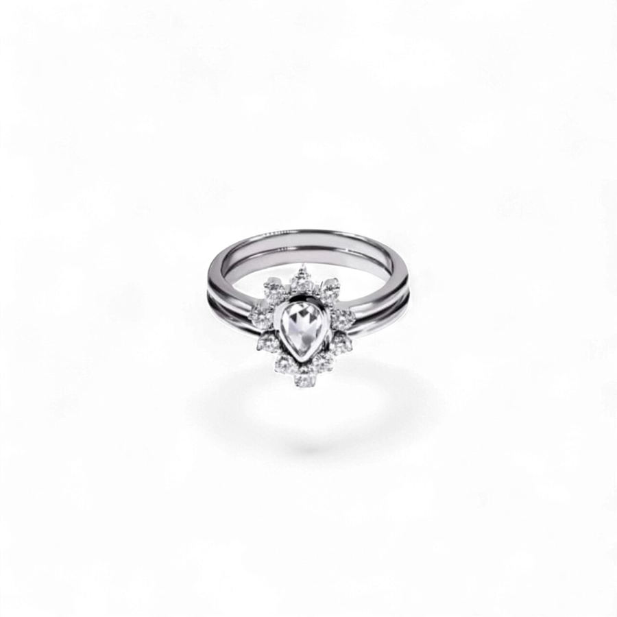 AVA & SSILAQUÉ Anillo de oro blanco de 14K con diamante de pera central y diamantes redondos acentuados.