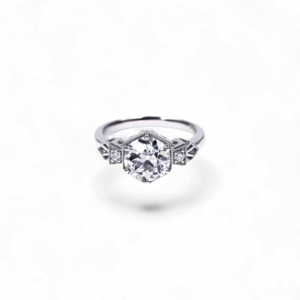 AVA & SSILAQUÉ Octavia Diamond Ring, 14K white gold with a large central round lab diamond and smaller side stones.