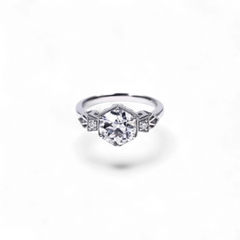 AVA & SSILAQUÉ Octavia Diamond Ring, 14K white gold with a large central round lab diamond and smaller side stones.