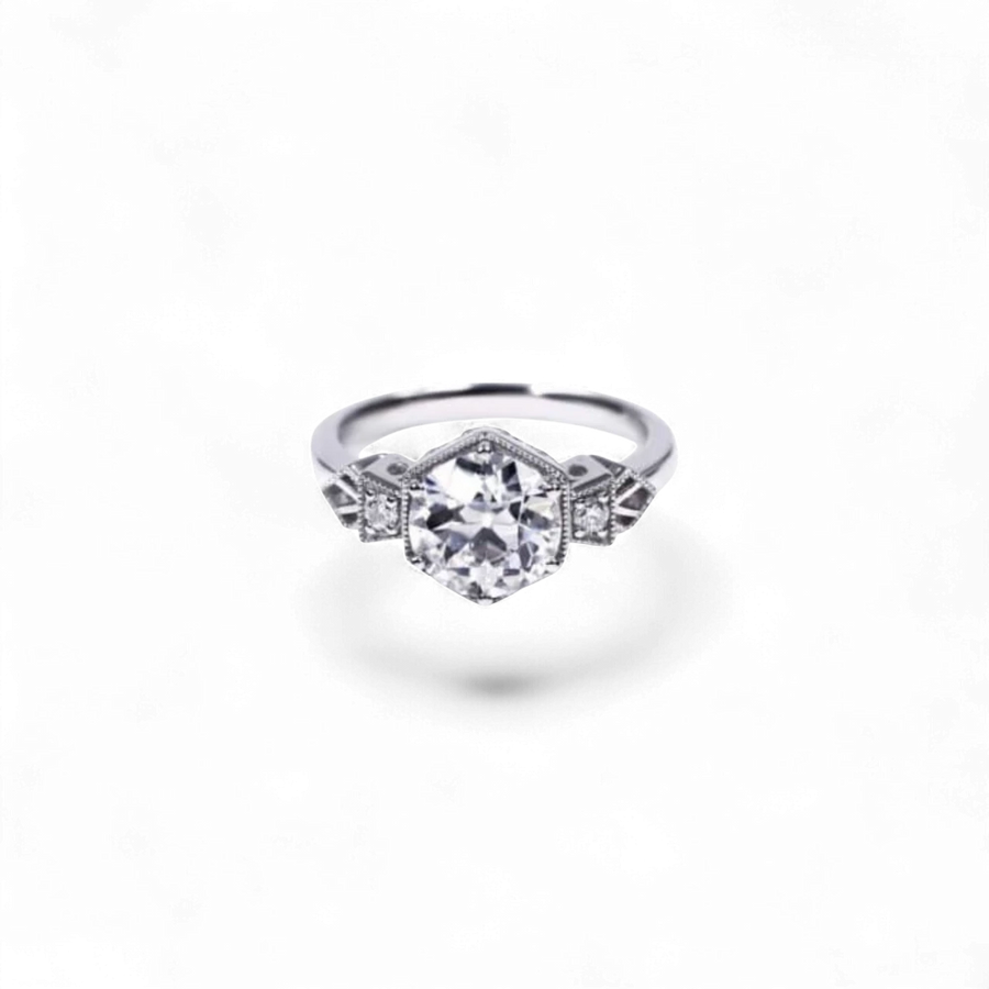 AVA & SSILAQUÉ Octavia Diamond Ring, 14K white gold with a large central round lab diamond and smaller side stones.